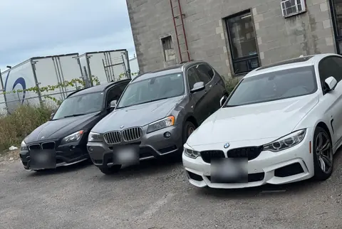 Three BMWs parked outside GTS Auto Repair