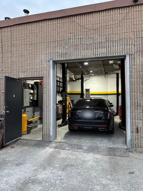 The GTS Auto Repair bay door seen from outside